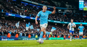 A high-quality, professional editorial photograph of a professional footballer in a vibrant Premier